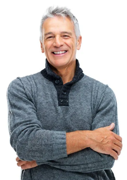 Portrait of a smiling senior man with gray hair crossing his arms, representing health confidence and physical wellness.